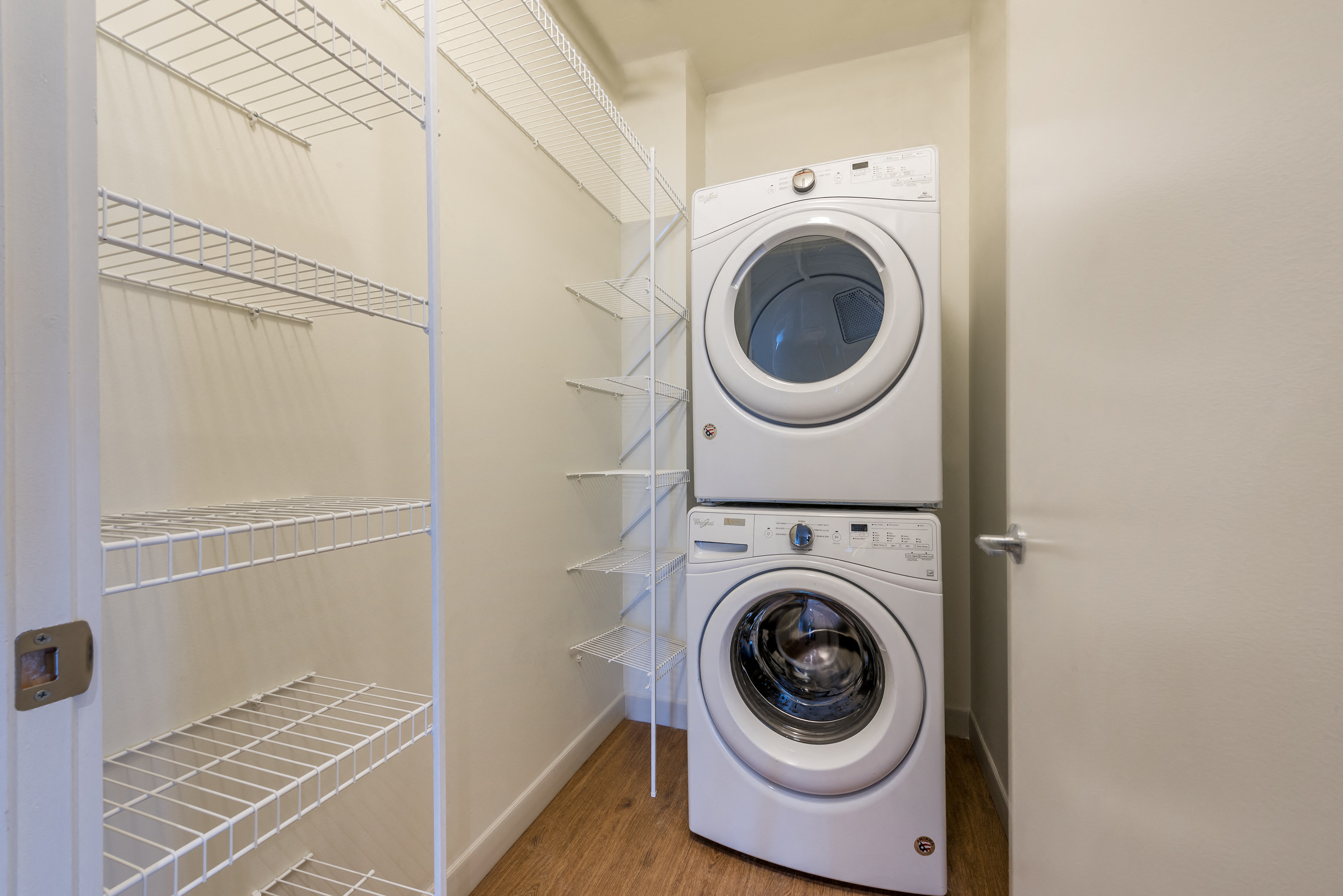 a washer and dryer in a laundry room next to a closet