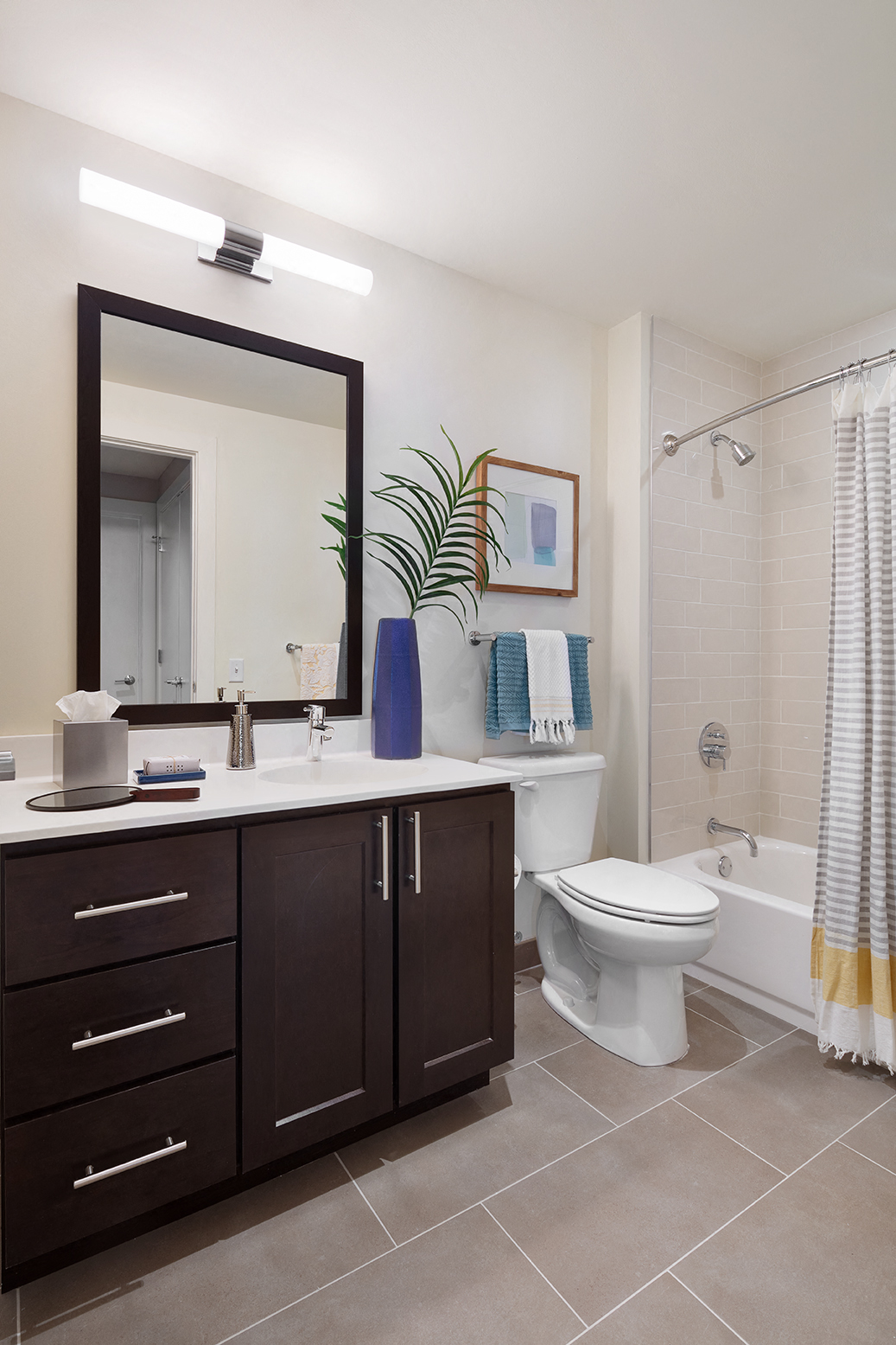 a bathroom with a toilet sink and a mirror