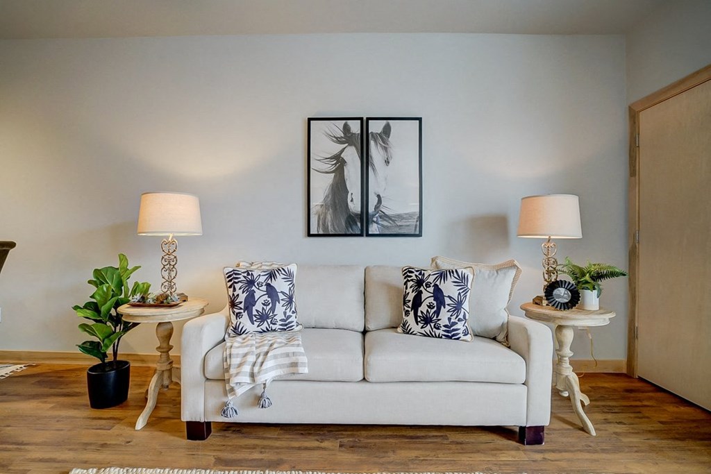 a living room with a couch and two tables