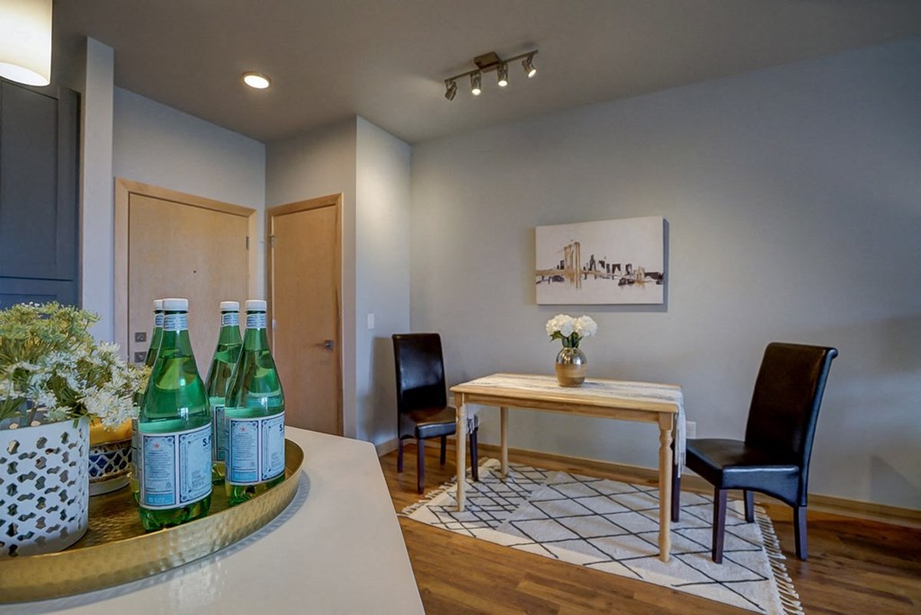 a dining room with a table and chairs
