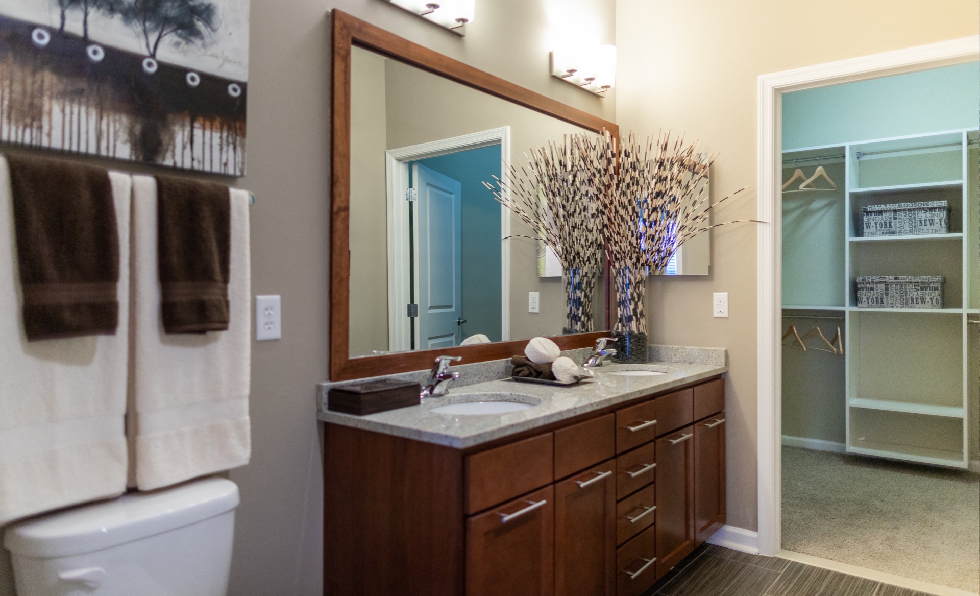 a bathroom with a large mirror and a sink