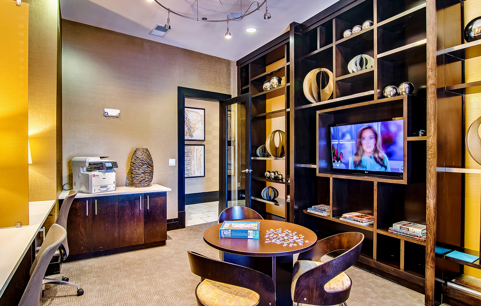 a living room with a tv and a table