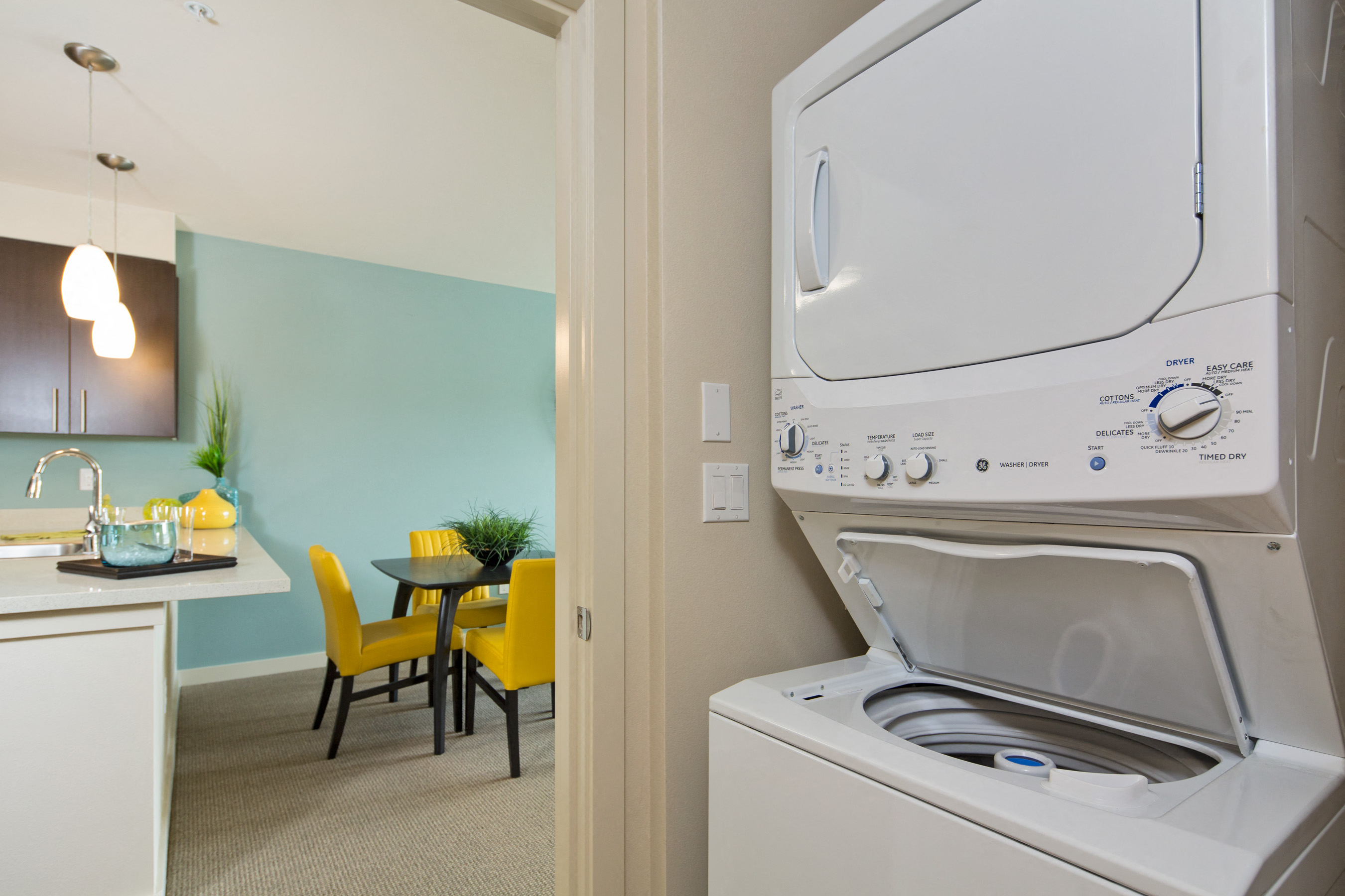 A white oven with a stove top is in a kitchen.