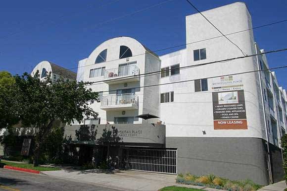 a large white building with a sign on the side of it