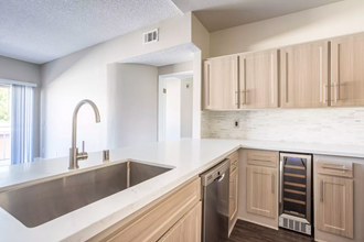 a kitchen with a sink and a dishwasher