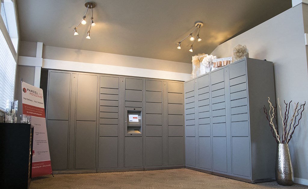 a large room with lockers and a vaulted ceiling with lights