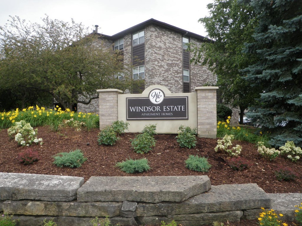 the front of a building with a sign for windsor estate