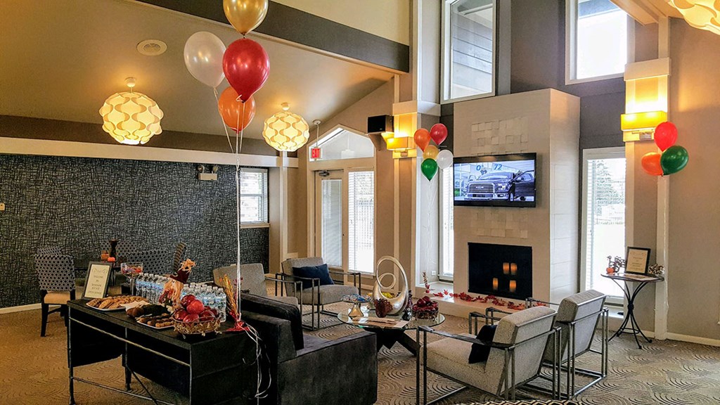 a party room with balloons and tables and chairs