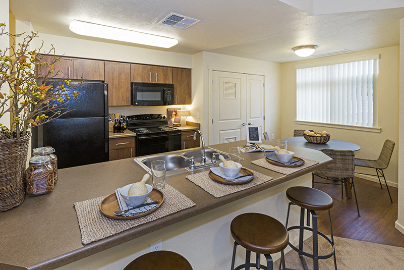 Full kitchen with dining area view Copper Range Apartments | Colorado Springs, Colorado
