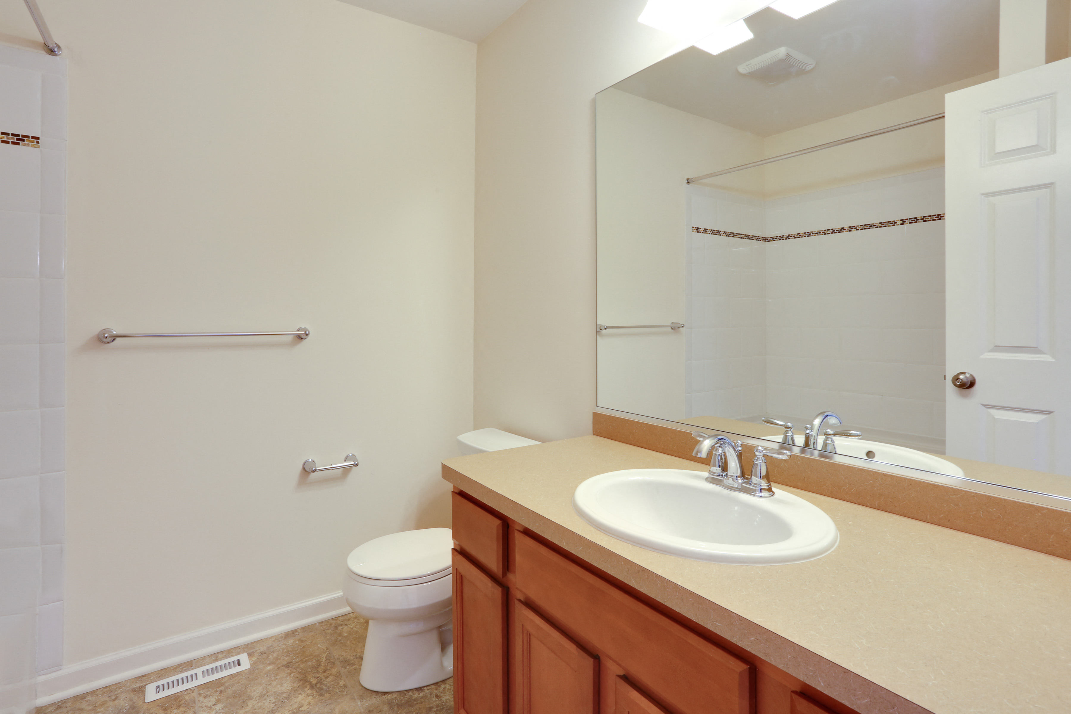 a bathroom with a sink toilet and a mirror