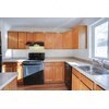 A kitchen with wooden cabinets and a black dishwasher.