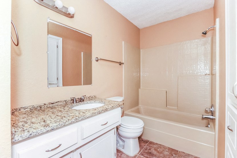 a bathroom with a sink toilet and a shower