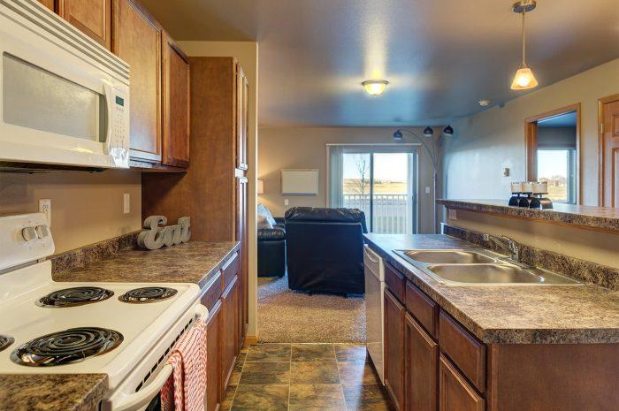 a kitchen with a stove and a sink
