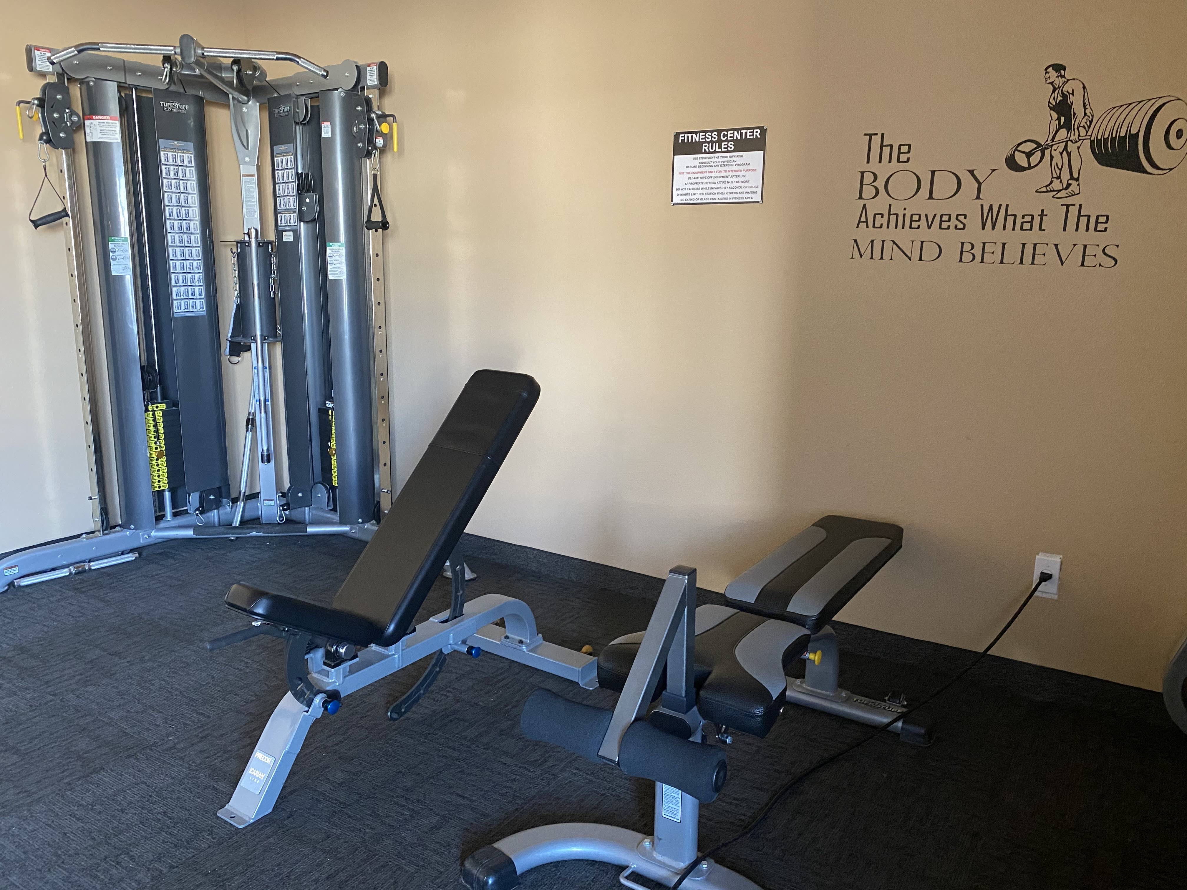 the gym has a lot of exercise equipment