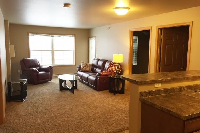 a living room with a couch and a table