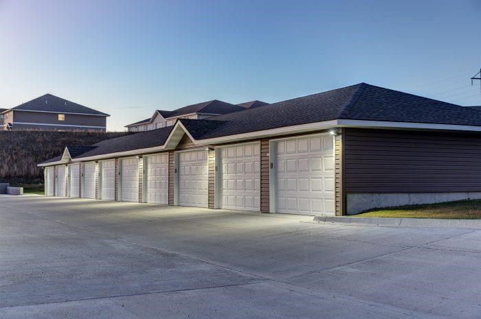 a row of garage doors on the side of a house