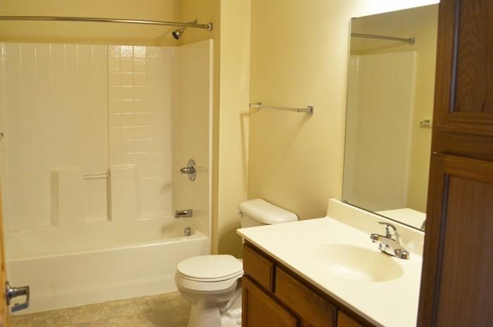 a bathroom with a sink toilet and a shower