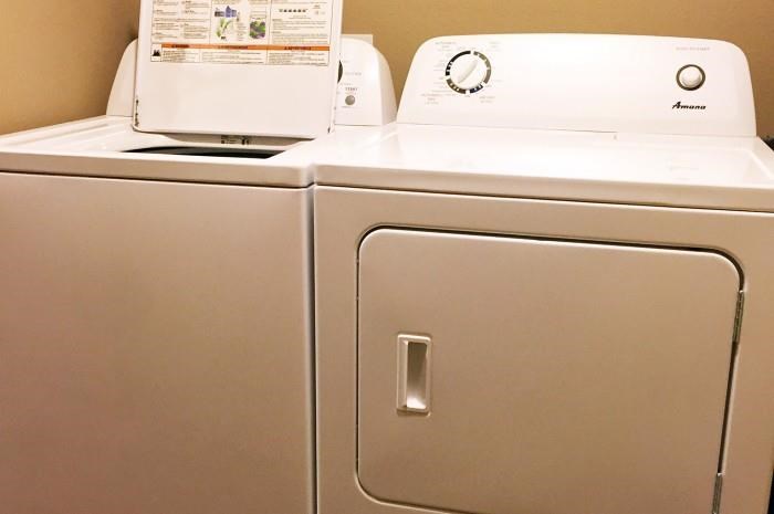 a white refrigerator with two machines on top of it