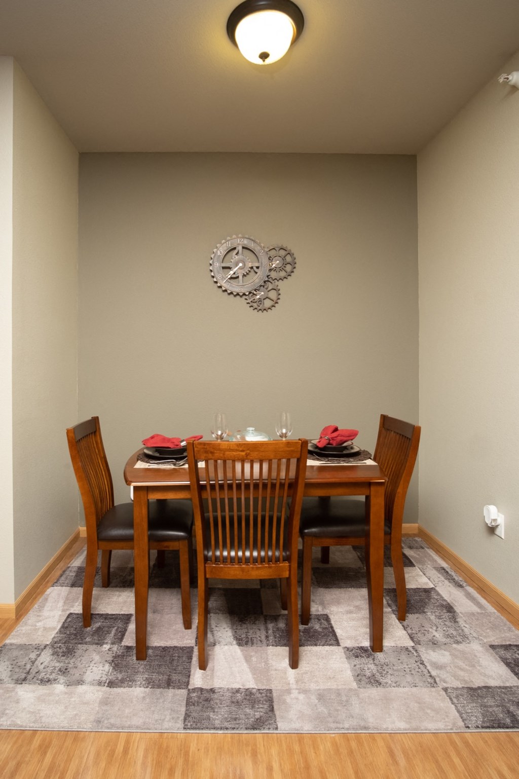 a dining room with a table and chairs