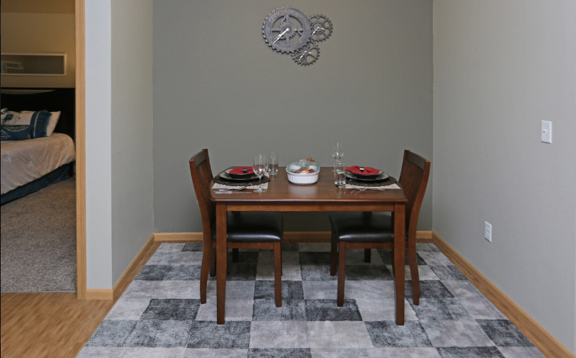 an image of a dining room with a table and chairs