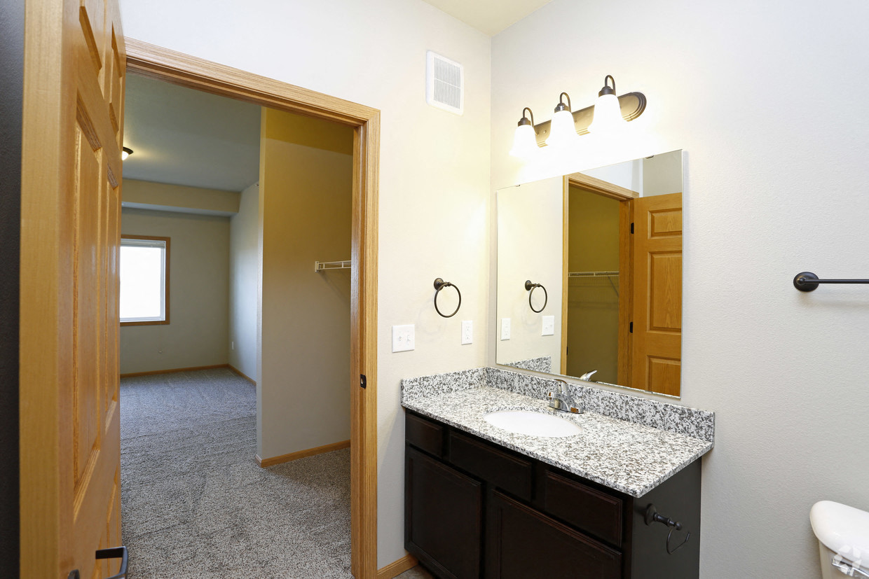 the view of a bathroom with a sink and a mirror
