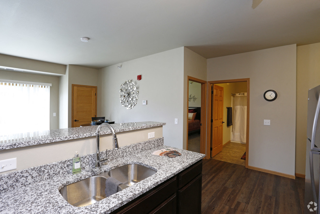 a kitchen with a granite counter top and a sink