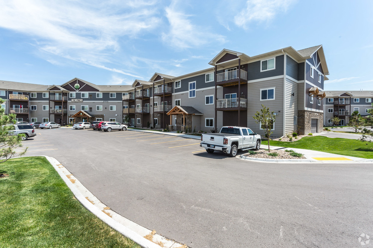 an apartment building with a truck parked in front of it