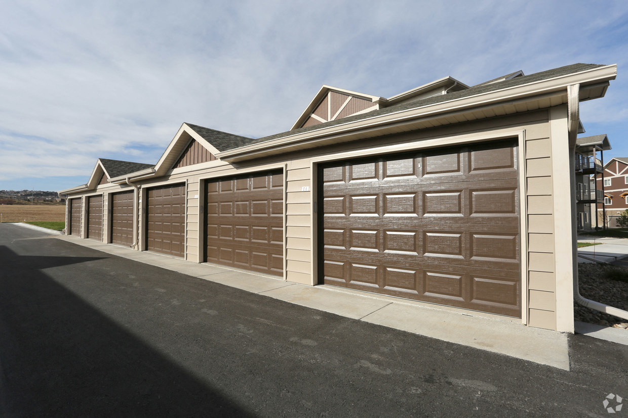 a row of garages in front of a house