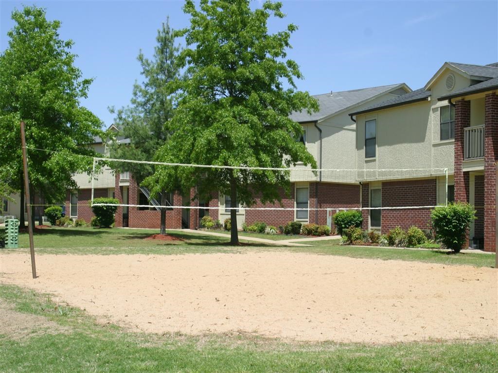 a volleyball court in front of an apartment building