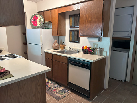 a kitchen with a sink and a refrigerator