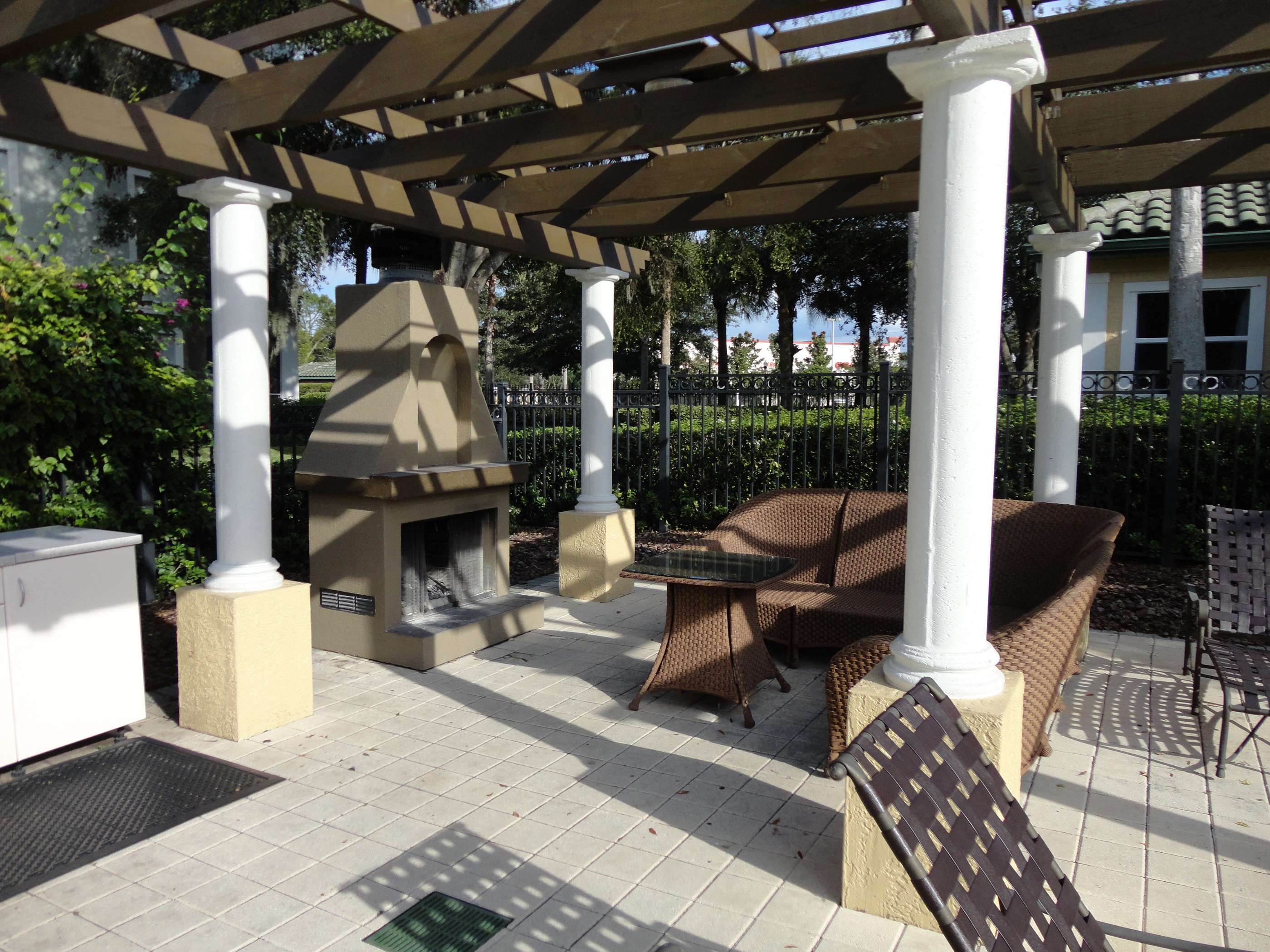 Outdoor sitting area with fireplace Allegro Palm Riverview Florida