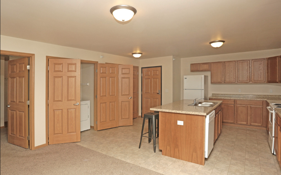 a kitchen with a center island and a counter top