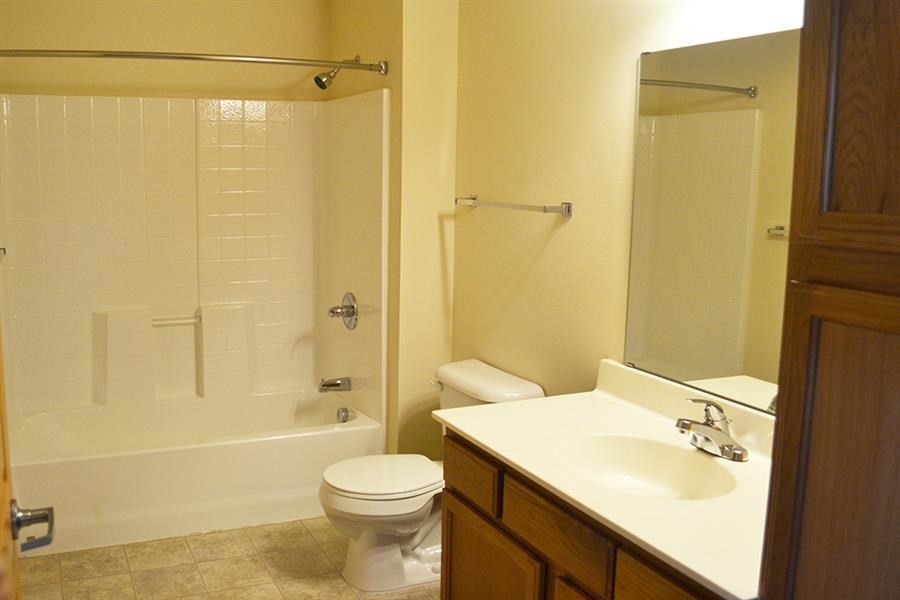 a bathroom with a sink toilet and a shower
