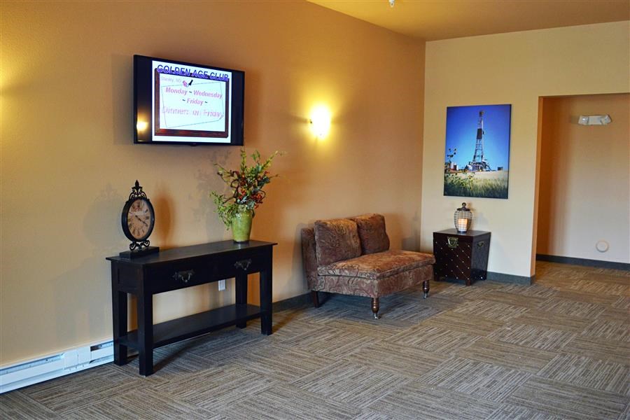 a living room with a tv and a chair