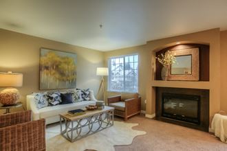 a living room with a couch and a fireplace