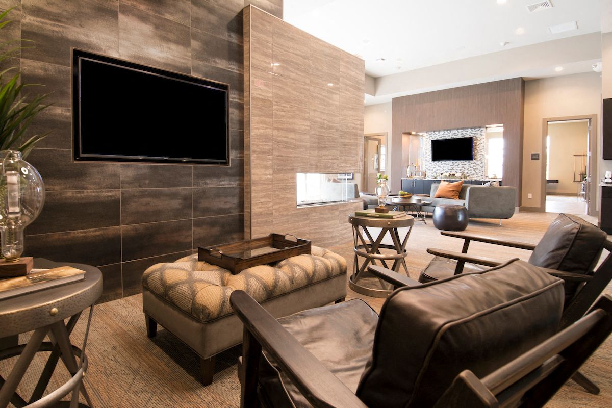 a living room filled with furniture and a television