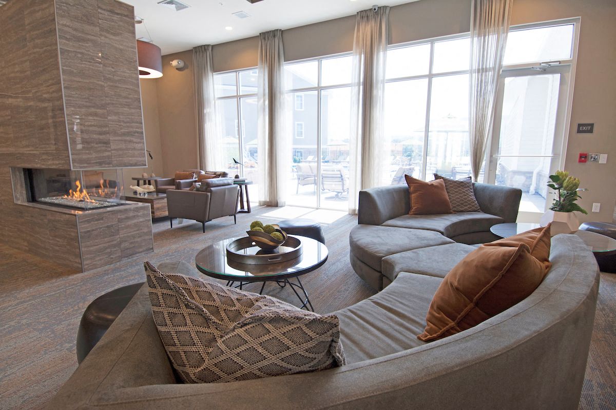 a living room with couches and a fireplace