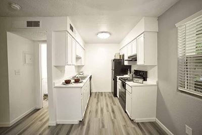 Kitchen with view of hall l Terrace Hill Apartments