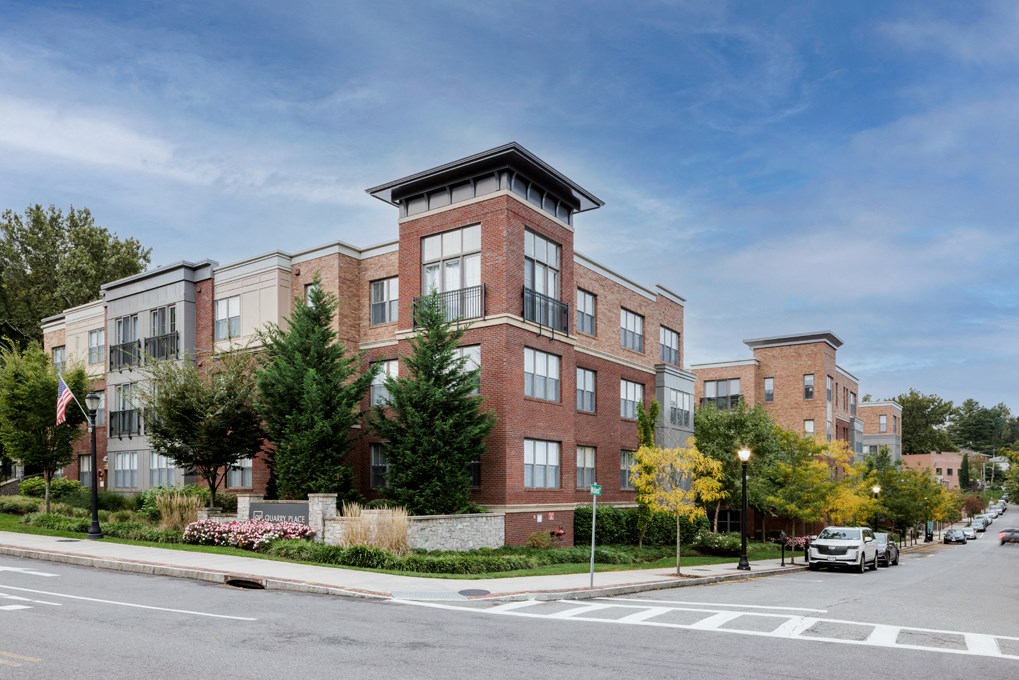 a brick building on the corner of a city street