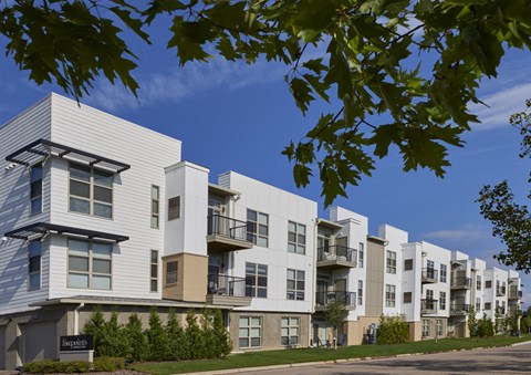 a row of apartment buildings on a city street