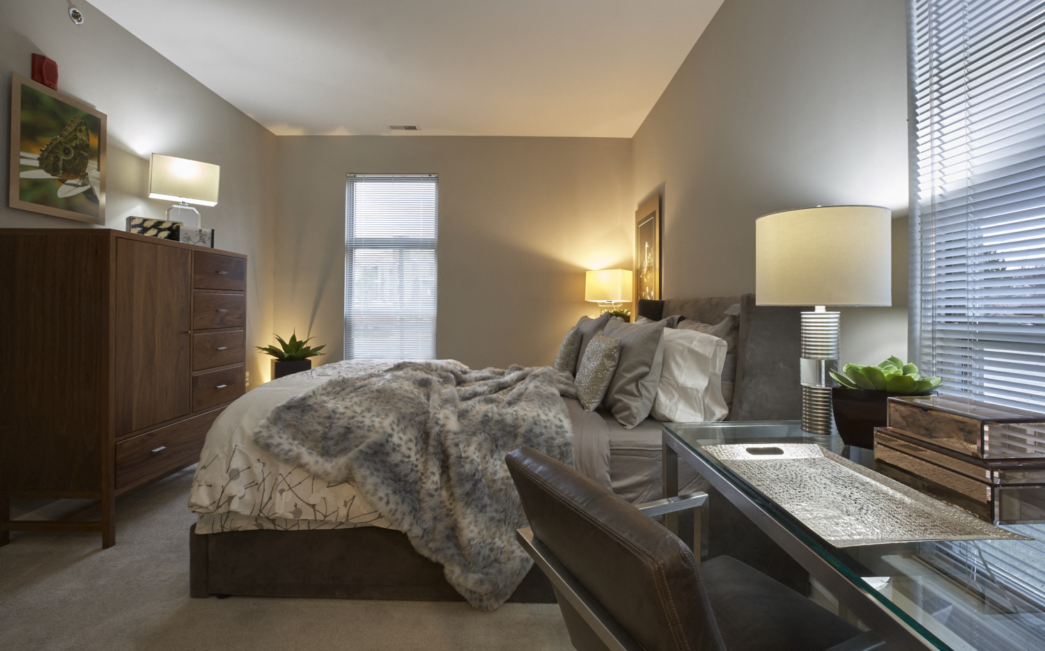 a bedroom with a bed and a desk