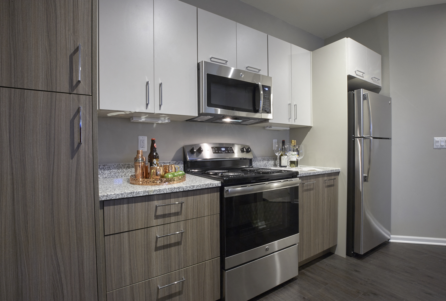 a kitchen with stainless steel appliances and white cabinets