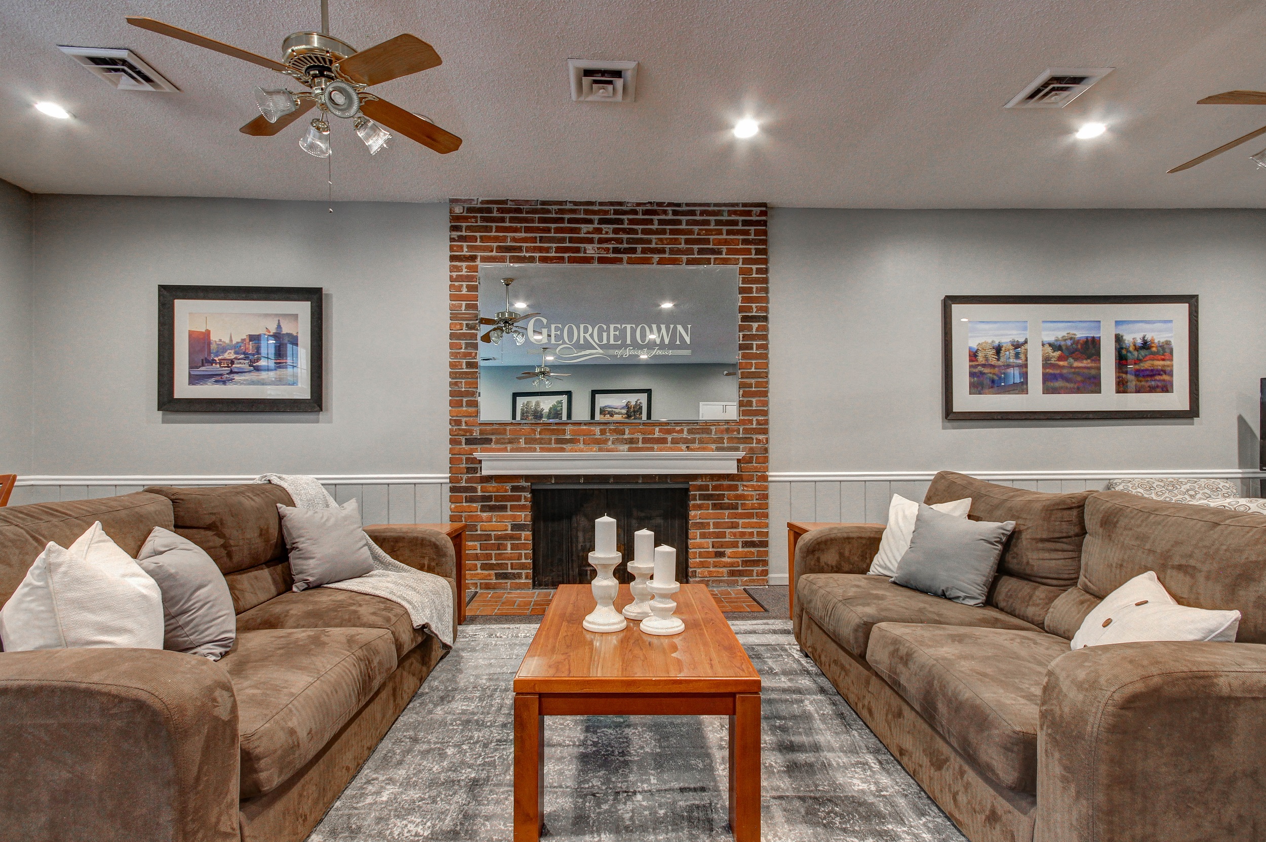 a living room with couches and a coffee table