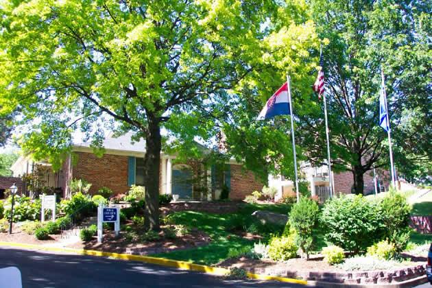 a building with two flags in front of it