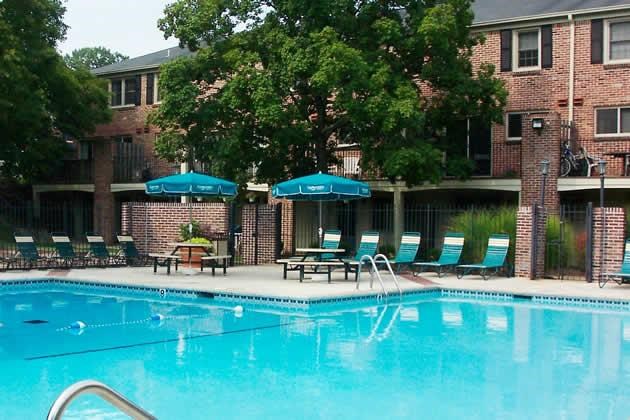 Charing Pool a large swimming pool with chairs and umbrellas
