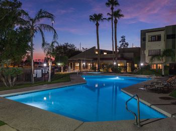 El Encanto pool with lounge chairs. 