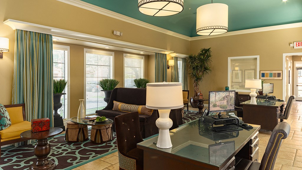 a living room filled with furniture and a large window