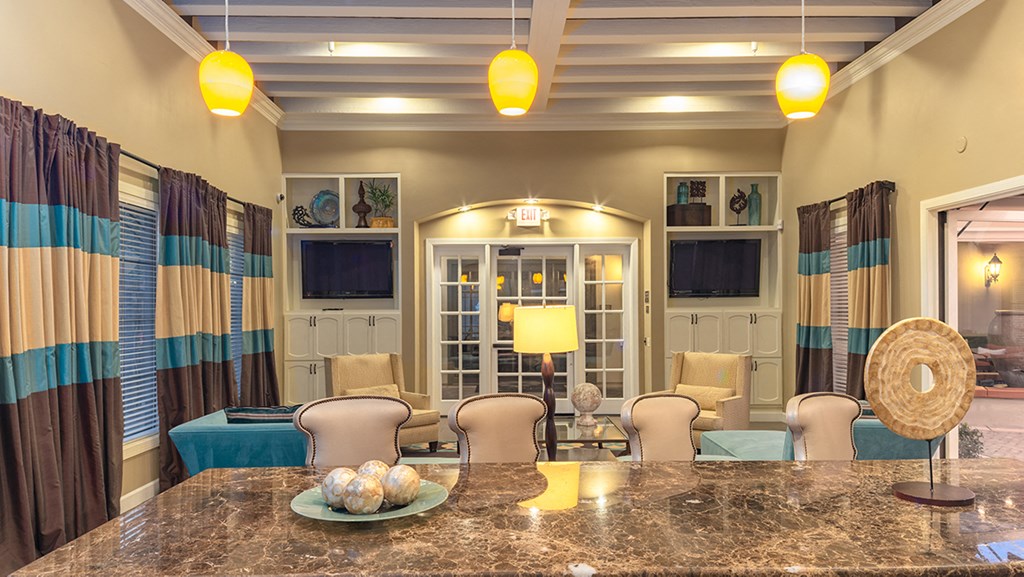 a living room filled with furniture and a large window