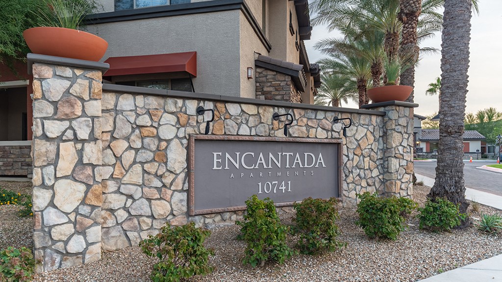 a sign in front of a building