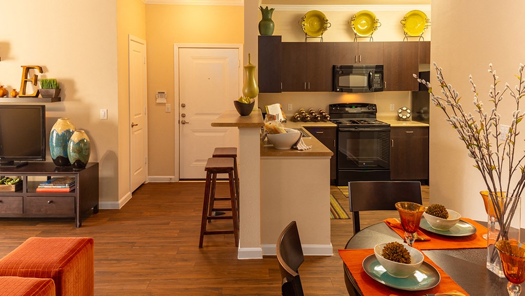 a kitchen and dining area in a 555 waverly unit